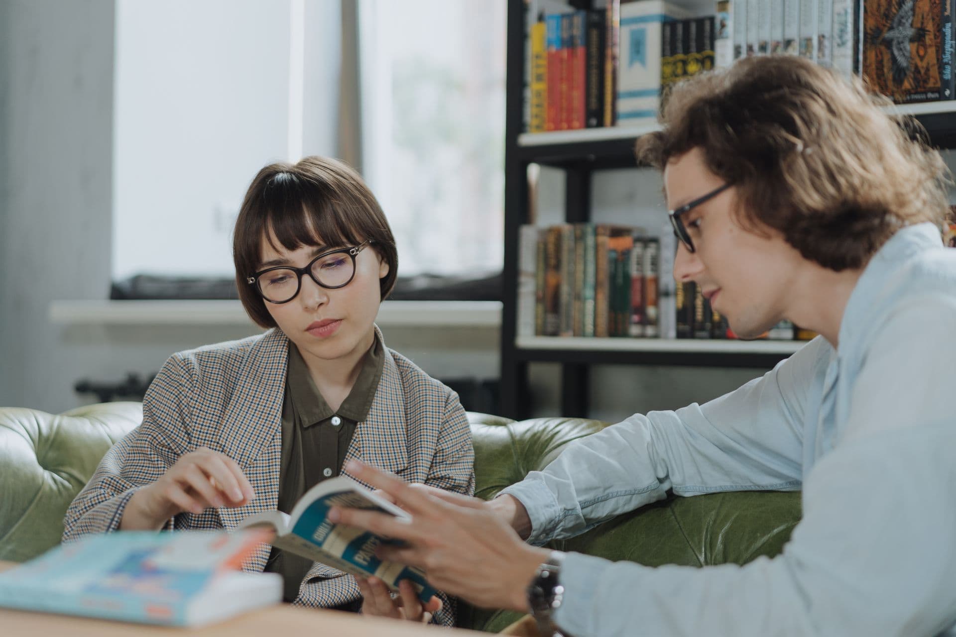 Researchers reviewing academic literature together