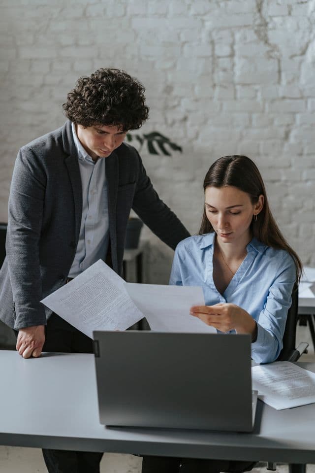 Researchers reviewing documentation together